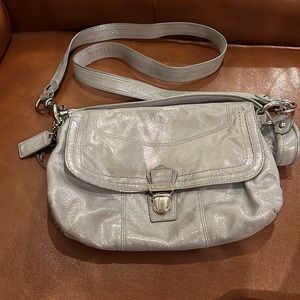 Coach silver shiny purse with buckle type closure